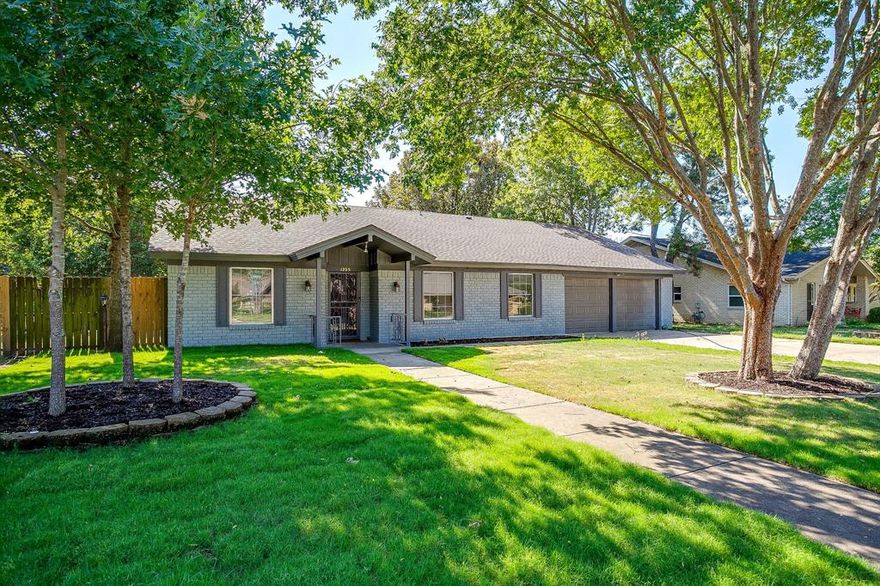 Welcome to this beautifully updated 3-bedroom, 2-bath home in the desirable Bellevue Crest neighborhood of Cleburne. Featuring fresh interior and exterior paint, brand-new flooring throughout, and new sod for great curb appeal, this home is move-in ready and full of charm. The spacious layout includes two living areas, a cozy brick fireplace, and a bright sunroom perfect for relaxing or entertaining. The kitchen offers built-in cabinets, dual sinks, and an eat-in area that flows into the dining spaces. The primary suite includes an ensuite bath with walk-in closet, while the secondary bedrooms provide plenty of space for family or guests. Outside, the large lot provides room to enjoy the outdoors with a covered porch and fenced backyard. With no HOA, a two-car garage, and a convenient location near schools, shopping, and dining, this home is the perfect blend of comfort and convenience. Owner financing available!