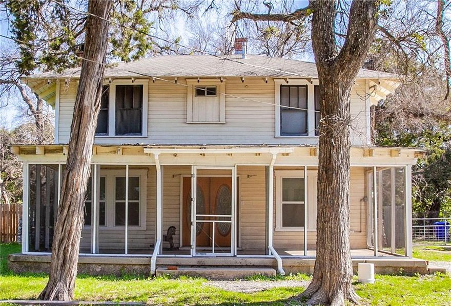 Excellent buy in this great investment sitting on 1 acre just one minute from McLennan Community College that includes 2 properties. Main home features 2 bedroom, 1.5 baths with large family room and is 1400 square feet. Kitchen with gas stove, microwave, fridge, and built ins. Additional features include large bedrooms, spacious laundry room with additional space for office space or mud room, screened in front porch. Guest house/mother in law suite is 1 bedroom, 1 bath, 720 square feet. Currently rented for $375.00, tenant paying own utilities. Perfect opportunity to create a rental income. Fabulous 1 acre lot with trees, 2 homes, and  priced to sell.