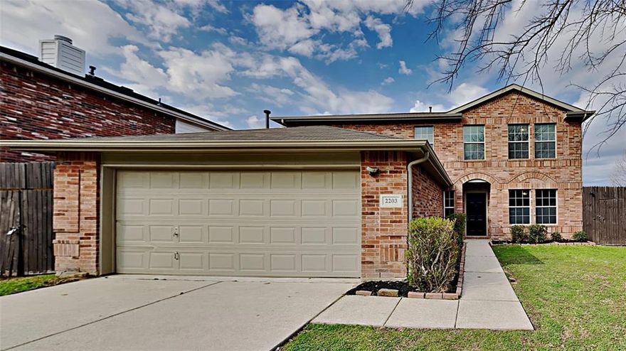 Welcome to your dream retreat at 2203 Wagon Wheel Trl, Corinth, TX 76208—a beautifully maintained 2-story brick home built in 2004, offering 2,470 sq ft of inviting living space on a generous 0.4-acre lot. Ideal for families or entertainers, it blends modern updates with a private backyard oasis for year-round enjoyment.

Step into the bright foyer leading to an open main level. The spacious living room (25' x 15') features luxury vinyl plank flooring, a cozy corner wood-burning fireplace, and large windows with pool views—perfect for gatherings. The formal dining room has an elegant chandelier and hardwood-style floors for memorable meals. The updated kitchen (22' x 12') shines with white shaker cabinets, quartz countertops, a functional island, stainless steel appliances (electric range, microwave, dishwasher), and ample pantry. Includes a half bath, laundry room, office (14' x 10'), and 2-car garage.

Upstairs, the primary suite (15' x 11') offers a ceiling fan, walk-in closet, and en-suite bath with dual vanities and separate shower. Two more bedrooms (approx. 11'-12' x 12') have fans and closets; shared bath with tub-shower combo. The versatile den (19' x 18') is ideal for media, play, or gym. Central HVAC, neutral tones throughout.
Outside: fenced backyard with  pool, shaded lounging, covered patio, expansive lawn, and red storage shed—pet-friendly and private.
Move-in ready—tour today!