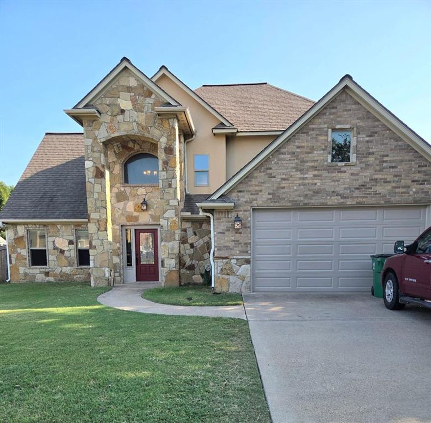 Beautiful 2 story, 4 bed, 2.5 bath home in Elk Ridge Estates. Cozy home with open floor plan, foyer entry with staircase, soaring ceilings, freshly painted textured walls and large windows. City view in front and country view in back with oversized backyard and privacy fence against wooded lot with wildlife. Listen to the bullfrogs sitting on your covered back porch. 2 car garage with new garage door. Kitchen features granite counter tops, solid wood cabinets, rotating shelf pantry, stainless appliances, new microwave, dishwasher, garbage disposal. Spacious Living room has rock gas fireplace and room for entertaining. Master bed-bath downstairs. Vaulted ceilings, soaking tub, separate tile shower, his-her closets, double sinks. Upstairs has Full bathroom with soaking tub-shower combo. 3 large bedrooms with huge closets. Hallway views downstairs foyer with beautiful window light. 2 attic spaces. New ac system! Warm and beautiful! Welcome to your dream home!