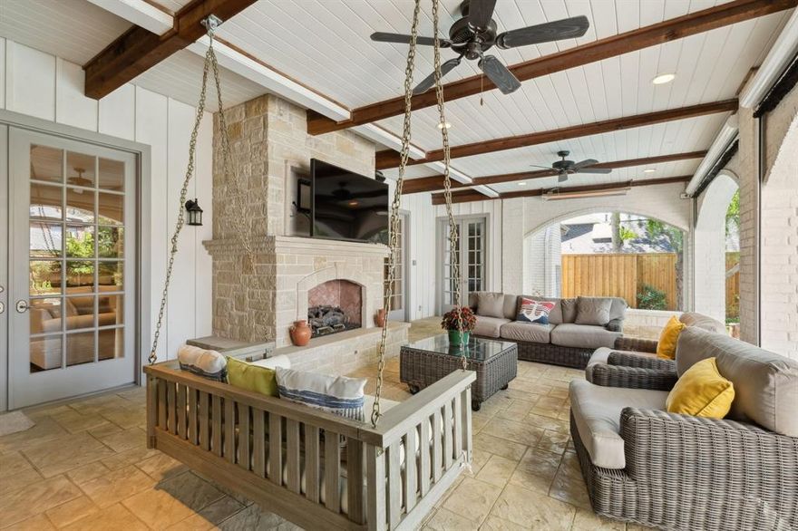 Preston Hollow Elegance—Nestled beneath majestic live oaks, this exquisite residence seamlessly blends modern luxury with timeless charm. Meticulously updated in 2024, it offers an exceptional living experience with five bedrooms, including a stunning first-floor primary suite. The chef’s kitchen is a culinary masterpiece, featuring a Sub-Zero refrigerator, double ovens, a gas cooktop, and a warming drawer. Seamless flow from the kitchen to the breakfast room area, family room and formal living room. French doors in the family room and breakfast area lead to a charming covered patio. Also on the first floor is the primary suite which provides a serene retreat with a cozy sitting area, fireplace, and french doors leading to a covered patio. The spa-like bathroom boasts separate his-and-hers vanities, a connecting shower, and custom walk-in closets. Throughout the home sophisticated design elements enhance its beauty, crown molding, quartz countertops, custom lighting, in-ceiling speakers, and rich hardwood floors. Upstairs, you'll find four spacious bedrooms, three baths, a dedicated office, and a large deck overlooking the backyard. The deck is accessible from the bedrooms.  A separate staircase leads to an expansive game room, perfect for entertaining. Step outside to an entertainer’s paradise. The outdoor living area features a kitchen area with a covered pergola, stone fireplace, and built-in grill—ideal for unforgettable gatherings. Also, a covered patio, complete with a fireplace, TV, and retractable electric screens and heaters offers the perfect spot to enjoy your morning coffee or unwind in the evening. The sparkling pool and hot tub are surrounded by lush, meticulously landscaped grounds, creating a private oasis.Completing this remarkable property is a three-car garage, offering ample storage and parking.