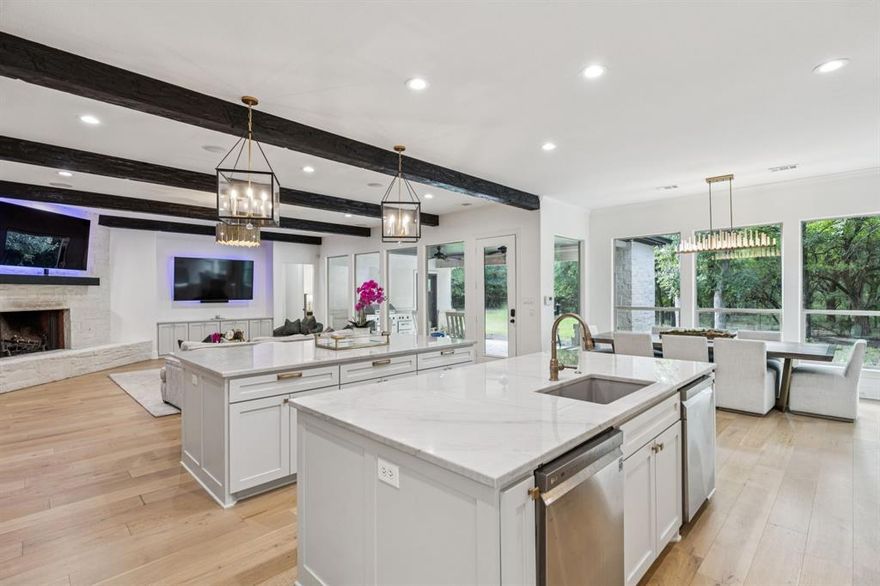 Nestled on 6 picturesque, wooded, Ag exempt acres in coveted Celina, this unique estate offers luxury living with rare versatility. A private drive leads to an elegantly reimagined home where custom finishes, open space, and peaceful surroundings create a truly special retreat. The kitchen is a showstopper,  fully remodeled with soft-close cabinetry, two oversized quartzite islands, lime-washed stone range surround, built-in coffee bar with floating shelves and full marble backsplash, warm champagne bronze fixtures. Designer lighting and under cabinet floor level LED accents add an elevated ambiance. Waterproof wood floors run throughout, complementing exposed beams and large picture windows that frame views of the trees and outdoor living. The spacious living room features a whitewashed stone fireplace and dual built-in media walls. A dedicated study with built-in shelving conceals a hidden bonus room, perfect as a hobby space or secure storage. Outside, the options are endless. A large, insulated steel building is plumbed for water and wired for electric, ideal for a gym, RV or boat storage, workshop or build a barndominium. Power is never an issue with the 27 kw back-up generator.  Starlink internet for reliable high-speed access. Springwell 3-Stage Water Purification system delivers crystal clear Well water. Small barn, chicken coop, pond, and seasonal creek all with no HOA and horse friendly. Enjoy the best of both worlds with acreage, privacy, and room to grow just minutes from Downtown Celina, all in acclaimed Celina ISD. This property blends elegant living with outdoor freedom. Your private Texas dream awaits.