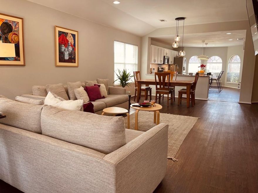 Adorable 3 BR, 2 BA single story with huge kitchen, sunlit living spaces and backyard with custom deck! Decorator colors, and luxury vinyl plank or tile flooring throughout most of the home. Large master suite with a large bedroom and bath with jetted tub, separate shower, walk-in closet and gorgeous, double-sink granite top vanity. Livingroom has gas fireplace and view of the backyard with covered porch, extensive deck and privacy fencing. Kitchen has white cabinets, stainless appliances and breakfast area. Large bedrooms, dining area, spacious entry, plus an extra-large utility room. Beautiful home in a convenient location with excellent schools. Refrigerator, washer and dryer are included.