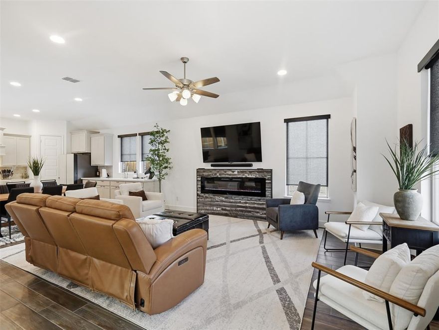 Welcome to this beautifully upgraded Perry Home offering the perfect blend of style, comfort, and convenience — with **NO MUD or PID** and located in highly sought-after Rockwall ISD with a low tax rate! This spacious property offers 3 bedrooms, 2 full bathrooms and French doors that lead you into a private home office! Designed with an inviting open floorplan, this home features a stunning stone accent exterior and thoughtful upgrades throughout. Inside, you’ll find custom window shades, an upgraded electric fireplace, and a plethora of storage to keep everything organized. The garage is equipped with extra storage racks, adding even more functional space. The chef’s kitchen is the heart of the home, showcasing a gas cooktop, walk-in pantry, and seamless access to the spacious covered patio— perfect for grilling and entertaining guests with ease. The smart split layout provides added privacy, separating the secondary bedrooms from the serene primary suite. Retreat to the primary bedroom with vaulted ceilings and enjoy a spa-like shower featuring double vanities. A dedicated mudroom adds everyday convenience. Step outside to enhanced upgraded landscaping lighting and enjoy being just steps away from the sparkling community pool and splash pad. The town of Fate also offers access to numerous parks and scenic trails, plus frequent food trucks and nearby restaurants for added fun and flavor. Location is everything with easy access to Hwy 30 and just minutes from shopping, including Fresh and newly opened H-E-B. This home truly has it all — upgrades, storage, privacy, community amenities, and an unbeatable location. Don’t miss your opportunity to make it yours!