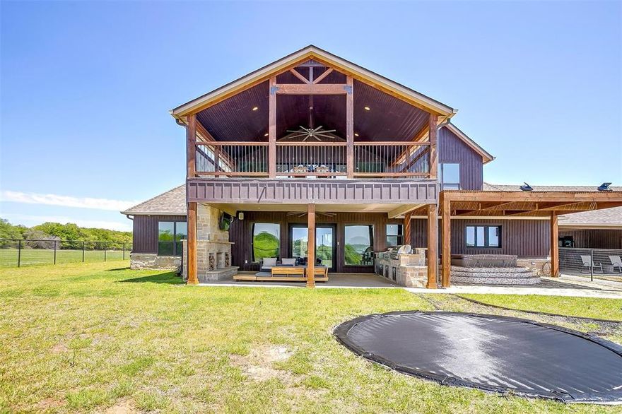 Welcome to this exceptional 42+- acre estate tucked away on the outskirts of Springtown. This remarkable ag-exempt property is a true gem, offering the perfect blend of luxury, country living, and development potential. Additional 53 acres available for purchase - MLS # 20908194. 
At the heart of the property lies a custom-built home featuring three bedrooms, three bathrooms, a game room, and a secret hidden basement with a walk-in gun safe. Designed for sustainability, it incorporates paid-off solar power, triple-pane windows, spray foam insulation, and meticulous engineering for maximum efficiency. 
Equestrian enthusiasts will appreciate the barn with four covered stalls with turnouts, an open-air lit arena tailored for team roping, and a covered arena for year-round use. Fully fenced and cross-fenced so bring all of your livestock! 
For those in need of space and versatility, the oversized shop includes a two-bedroom apartment, an air-conditioned gym, and ample covered parking for all of your toys and equipment. Additionally, an extra building with two bedrooms and a half-bath makes this property ideal for multi-generational living and screams FAMILY COMPOUND! 
Outdoor lovers will revel in the hunting and recreational opportunities with a scenic mix of trees, a creek, and two stock tanks. Become the ultimate party host with a Sports Court and Shuffleboard Court ready to be played on! Conveniently located with paved road access on both sides and two gated entries, this acreage also presents exciting development potential. 
Whether you're seeking a private retreat, a thriving agricultural estate, or a place for friends and family to call home, this property offers endless possibilities. Don’t miss your chance to own a slice of paradise in Parker County!