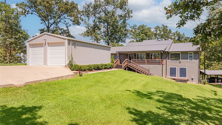 Charming Waterfront Home with Extensive Updates and Modern Amenities. Experience the best of lake living in this beautifully updated 3-bedroom, 2.5 bath home with 1,752 sq. ft. of open-concept living space, perfectly situated on a serene .613-acre lot on Lake Bob Sandlin. This home has been carefully maintained and upgraded over the last 4 to 5 years, making it move-in ready. Recent upgrades in the past 4-5 years include a metal roof and exterior paint on the home, decking, and boat dock; retaining wall replaced along the waterfront; expanded boat dock with new electrical box, cradle lift, and two floating PWC docks; wood deck, covered porch, and stairs with built-in outdoor lighting and speakers; huge concrete driveway; oversized 4-car garage 44x24x12 insulated, wired, with LED lighting, 10x10 doors, and an ice maker; fully sodded yard with sprinkler system and landscape lighting; and interior renovations including new flooring, paint, and an updated kitchen island with beverage fridge. Furnishings are available with the right offer (with some exclusions). Key features include a bright, open living area with large windows, skylights, and lake views; master suite with direct deck access and water views; under-house storage with electricity for lake gear and equipment; and community amenities including a pool, park, and boat ramp. This home combines modern convenience with lakeside relaxation perfect for weekend getaways, entertaining family and friends, or enjoying peaceful full-time living. Schedule your private showing today and see why Thunderbird Point on Lake Bob Sandlin is the perfect place to call home.