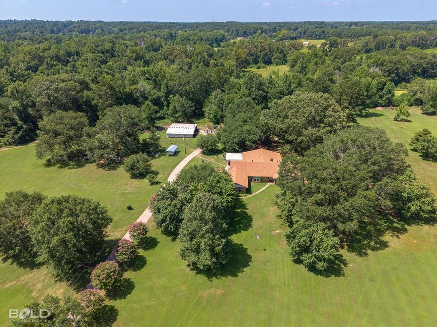 If you have to been looking for Acreage and a large family home, this could be the one!  Located on Highway 1 and only 7.5 miles from 1-220 and 3.5 miles from I-49 heading toward Blanchard.  When looking at the aerial views, you will see that the 3300 SFHA home is situated on 6 beautifully groomed and cleared Acreage, and the additional 13 Aces are situated to the left of the home with so many possibilities.  This home was built and has been well loved by the present owners since 1977.   It also has 2 HUGE living areas, separate dining room, eat in kitchen, 3 bedrooms, 3 baths and lots of room to roam.  This unique property has just been appraised  and it is priced to move quickly.  If interested, make an appointment to view.  You might even see some deer in the backyard!
