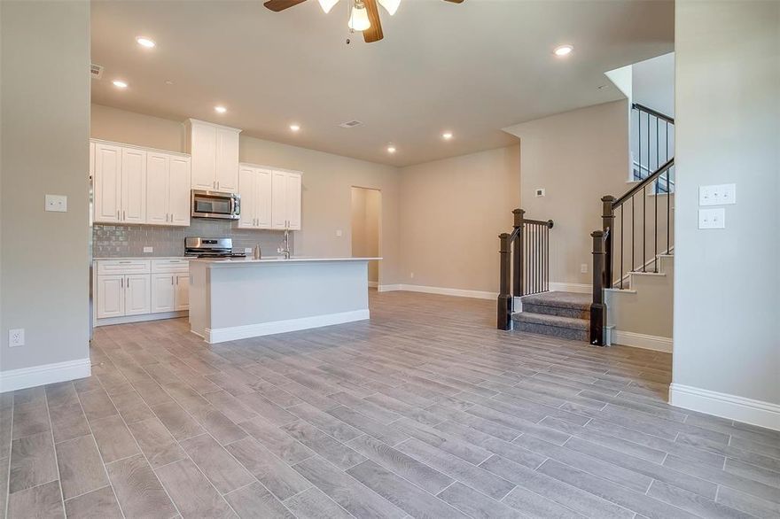 NEW luxury townhome nestled in Gables at Ohio community offers a lifestyle of comfort and convenience. Featuring open floorplan that combines elegance with functionality, modern wood-like tile flooring flows throughout, with abundance of natural light that bathes the interior. The heart of the home is the kitchen featuring breakfast bar, sleek quartz countertops, ample cabinet space, and new appliances. The open floor plan extends to second level, where a cozy game room awaits offering additional space for relaxation. As you ascend the staircase, you'll find three spacious bedrooms. The primary bedroom has en-suite bathroom and walk-in closet. Conveniently located minutes from 121 and DNT, this townhome is walking distance from Collin Community College's Frisco Campus and Lebanon Trail High School. The HOA maintains front yard, and the large attached garage provides secure parking and extra storage space. New refrigerator, washer, and dryer included.