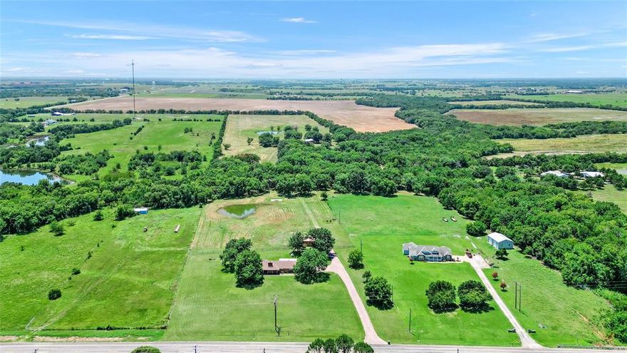 This 40-acre equestrian property is situated in the heart of Horse Country, conveniently located just east of Whitesboro along Hwy 56. The land features an array of lovely, scattered trees that enhance its charm and line the fenced perimeters. Included with this property is a spacious three-bedroom, two-bath home boasting over 2200 square feet, set back from the road to provide privacy. The generous master suite comes complete with a well-appointed ensuite bathroom. A covered patio at the rear showcases stunning views of your expansive grounds and wide-open spaces. Additionally, there’s a 20x40 barn featuring a 10-foot overhang positioned directly behind the house, while provisions for another 40x60 structure can be made to accommodate your needs and those of your animals; plus, enjoy ponds available for watering or casual fishing whenever you like.