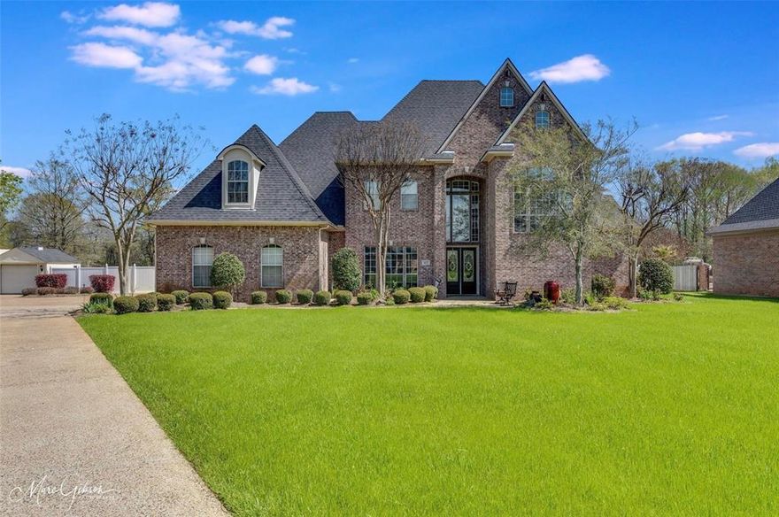 Beautiful custom home situated on 1.23 acres overlooking the bayou in the desirable Lucky Estates community. This 4,400+ sqft home offers 4 bedrooms, 3.5 baths, and a versatile layout with multiple living and dining areas, a library with built-ins, game room, and exercise space.

The kitchen features a gas cooktop, wall oven with separate built-in microwave, large island, and butler’s pantry, opening to spacious living areas with soaring ceilings, abundant natural light, and custom built-ins. The primary suite is located on the first floor with a large ensuite bath including dual vanities, jetted tub, separate shower, and walk-in closet.

Step outside to a true backyard retreat featuring an in-ground pool with rock waterfall, spa, outdoor kitchen, fireplace, and pergola—all overlooking the bayou. The outdoor living space is ideal for entertaining or relaxing while enjoying the privacy and views.

Additional highlights include a 4-car garage, side-entry parking, and no HOA.

Potential assumable sub 3% VA loan available for qualified buyers with entitlement. Buyer must meet lender and VA requirements.

A rare opportunity to own a private waterfront property with space, functionality, and resort-style amenities in South Bossier.