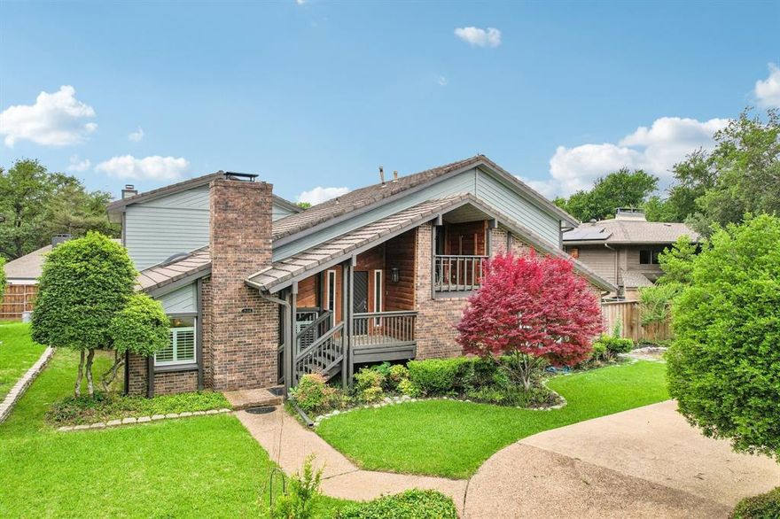 Welcome to this custom contemporary split-level in the heart of Far North Dallas, zoned to coveted Brentfield Elementary. Thoughtfully designed for flexibility and everyday living, the home features a primary suite on the main level plus three generously sized bedrooms upstairs that share an updated bath in crisp whites and greys. One upstairs bedroom even enjoys a private balcony—perfect for morning coffee.A standout bonus is the secondary flex space with beautiful pool views—ideal as a second living area, full guest suite, or multi-generational setup—complete with its own private staircase and separate balcony entrance for added privacy. Outside, enjoy a true backyard retreat with mature landscaping, a pool and multiple entertaining areas plus a grassy area for pets. Practical upgrades include new siding (2023), water heater (2023), a primary bath remodel (2021), updated windows, and a Tesla EV charger with PowerShare installed (2024). A circular drive adds curb appeal and convenience, while the alley-access garage entrance keeps the front elevation clean and uncluttered. Storage is a standout throughout the home, with thoughtfully designed built-ins in the family room—perfect for display, books, and media—and an additional built-in workspace at the loft landing at the top of the stairs, ideal for homework, a home office, or a command center. Even the space under the living room stairs has been maximized with extra built-in storage, keeping everything organized without sacrificing style. Plantation shutters at all front-facing windows add timeless curb appeal.This is a rare blend of character, function, and location—don’t miss it.