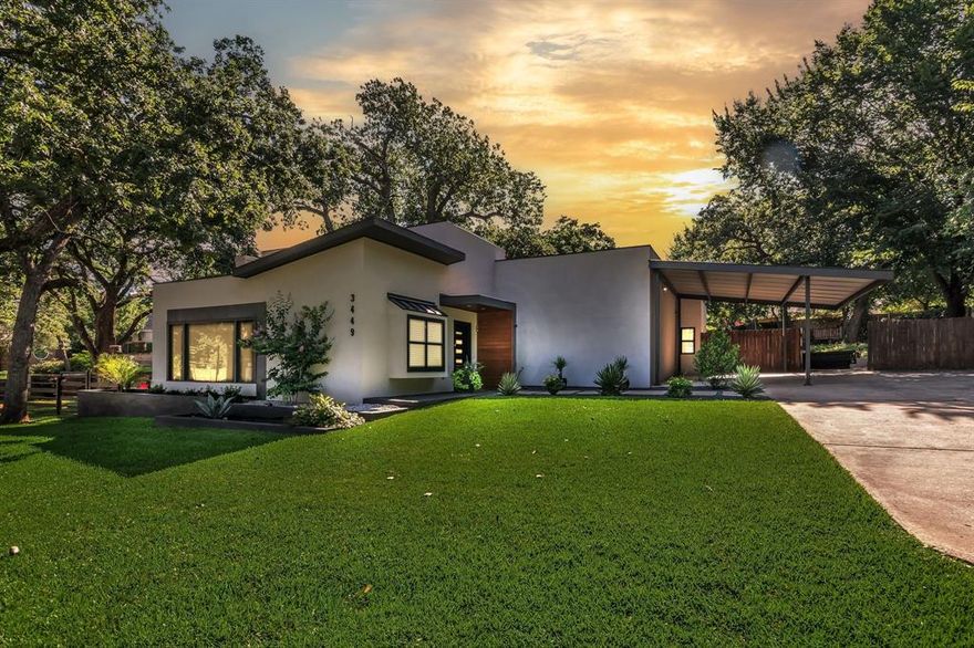 Nestled in the heart of Grapevine, this stunning property offers a rare sanctuary on a sprawling half-acre wooded lot. Shaded by a soaring canopy of mature, towering trees, the backyard provides a private park-like setting that is increasingly hard to find. The location is truly unbeatable, situated just two blocks from the beloved Parr Park and within walking distance to exemplary elementary, middle, and high schools in the highly sought-after Grapevine-Colleyville School District. Commuters and travelers alike will appreciate being only a short drive from the airport.

Inside, you are greeted by a light and bright open-concept floor plan designed for modern living. The expansive great room serves as the heart of the home, featuring a cozy wood-burning fireplace and a magnificent wall of windows that invites the beauty of the outdoors inside. The gourmet kitchen is a showstopper, boasting elegant granite countertops and a striking turquoise tile backsplash that adds a unique touch of character. For those working from home, the formal dining area is perfectly suited for a quiet office space.

The primary suite offers a peaceful retreat with direct exterior access to the lush grounds. Additional features include spacious secondary bedrooms, a bathroom with dual sinks, and a guest house that can also be used as a dedicated office or mother-in-law quarters. This home is as functional as it is beautiful, equipped with energy-efficient heating and cooling systems to ensure year-round comfort. The exterior is equally impressive, featuring a large storage shed with electricity, a substantial deck for entertaining, and ample space for recreational vehicle or boat parking. This is a rare opportunity to own a piece of Grapevine paradise that perfectly balances natural beauty with modern convenience.