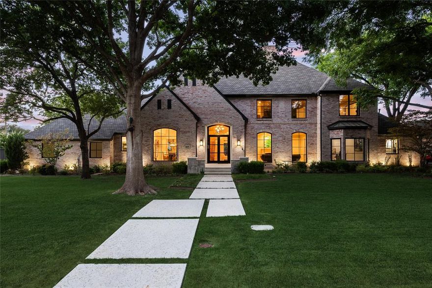 Preston Hollow transitional recently renovated offering tranquil living in close proximity to Dallas' finest shopping, dining and private schools. Stately exterior with Pella Series Architect windows and doors nestled on an approximate half-acre lot in a serene tree-lined neighborhood. Exceptional finishes are accentuated by an open floor plan, tall ceilings, and white oak flooring. Elegant foyer with wrought iron staircase is flanked by the gracious formal living and dining areas. Kitchen-breakfast area with center island, natural stone countertops, Wolf gas range, double ovens, and Subzero fridge is open to the family room with fireplace and French doors leading to the outdoor living area and generously sized backyard. First floor primary suite with fireplace and sitting area features dual sinks with natural stone countertop, soaking tub, rain shower, and custom finished walk-in closet. Other amenities include temperature-controlled wine room, pier & beam foundation and 3 car garage.