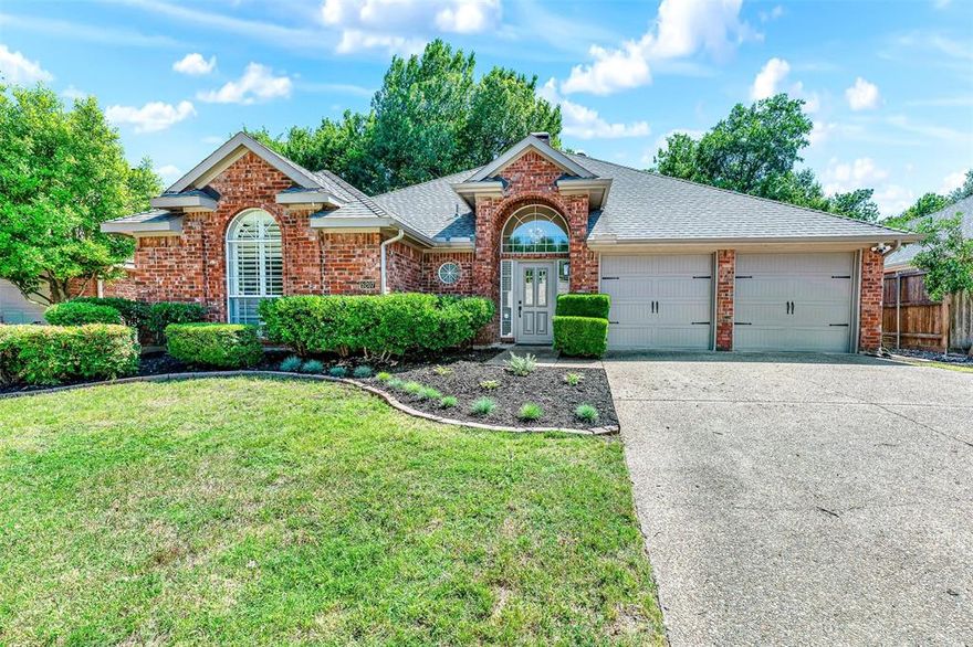 Absolutely gorgeous single-story in Stonebridge Ranch’s Briar Ridge neighborhood with luxury finishes and designer details throughout. From the moment you walk in, this home feels elevated with beautiful wood floors, soaring ceilings, custom lighting, oversized baseboards, solid-core doors, and a stunning floor-to-ceiling tiled fireplace that anchors the main living space. The layout is incredible with TWO oversized living areas designed for both entertaining and everyday comfort. The family room is filled with natural light from the wall of windows overlooking the serene backyard and also features custom built-ins and a wet bar. The kitchen is beautifully updated with designer quartz countertops, white shaker cabinetry with soft-close drawers, under-cabinet lighting, gas range with air fry feature, stainless steel appliances, recently updated dishwasher, microwave, and disposal. 
The primary suite feels like an upscale private retreat with a spa-style bath featuring quartz counters, a freestanding tub, oversized frameless glass shower, and walk-in closet. Secondary bedrooms are generously sized with walk-in closets as well. Major upgrades include a top-of-the-line Lennox Elite HVAC system, recently replaced water heater, garage door openers, and custom landscape in both the back and front of home. Every inch of this home has been thoughtfully updated and impeccably maintained. Truly move-in ready and absolutely stunning close to exemplary schools, shopping, Adriatica, Stonebridge Ranch incredible amenities.