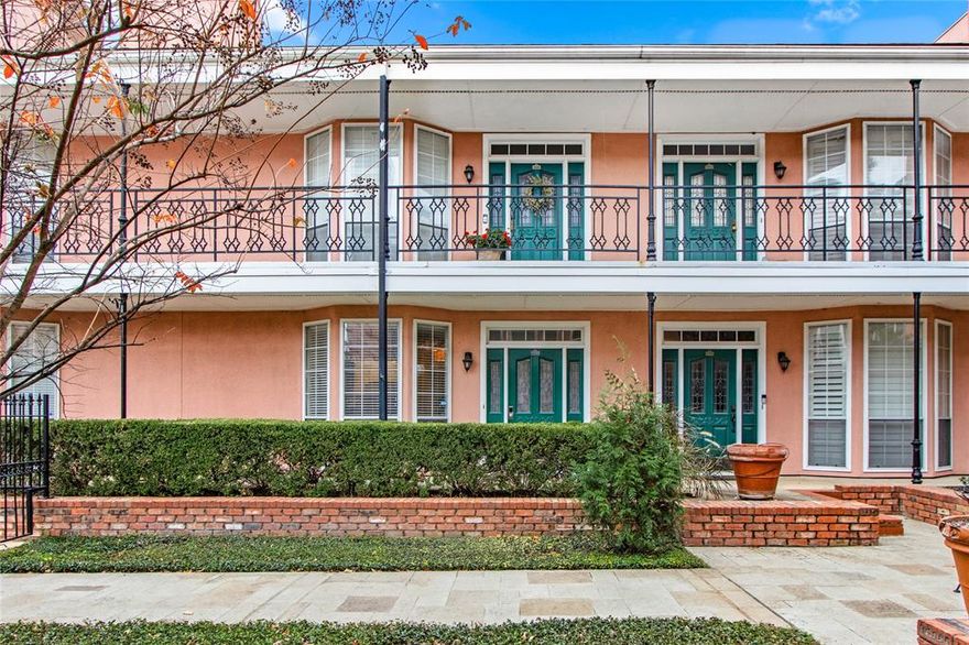 Condominium located in the heart of Uptown Dallas with convenient access to McKinney Avenue, major thoroughfares, and dining. Unit features an open-concept layout with wood flooring throughout and ample natural light. Living and dining areas flow into the kitchen, which offers generous cabinet and storage space.

The unit includes a large private fenced patio providing outdoor living space and overlooks a landscaped common courtyard with direct access to the community pool. Two wood-burning fireplaces are included. Primary bedroom features a custom walk-in closet with built-in storage. Secondary bedroom is well sized with a large closet.

Recent improvements include patio decking replacement in 2023 and water heater replaced in 2022.

Property includes multiple parking passes, including one assigned garage space. Washer, dryer, and refrigerator convey with the sale. Two pets are allowed with a weight limit of 35 pounds.