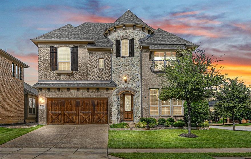 STUNNING LANTANA BEAUTY WITH AN INCREDIBLE BACKYARD PERFECT FOR ENTERTAINING! There’s room for the whole family in this gorgeous home boasting extensive handscraped wood flooring, fresh paint downstairs, soaring ceilings, wrought iron spindles, California Closets, a floor-to-ceiling stone fireplace & a home office with French doors & built-ins. Cooking is a breeze in the pristine kitchen featuring granite countertops, stainless steel appliances, under cabinet lighting, a beverage cooler, butler’s pantry & a breakfast bar. End your day in the downstairs primary suite including new carpet, a dual sink granite vanity, oversized frameless shower with a rain shower head, soaking tub & a massive California Closet with access to the laundry room. Make great use of the upstairs offering a private media room with a wet bar, large game room & generous secondary bedrooms. Spend spring evenings relaxing in your low-maintenance backyard showcasing artificial turf grass, a large covered patio with an outdoor kitchen, a huge pergola covered patio with an outdoor TV & an extended patio with a fire pit area. Recently replaced AC units, roof & several windows. Lantana amenities include a golf course, pools, splash pad, parks, playgrounds, fitness centers, tennis, pickleball, miles of trails, tons of community events & more! Take a first-person look at this gorgeous home! Click the Virtual Tour link to see the 3D Tour!