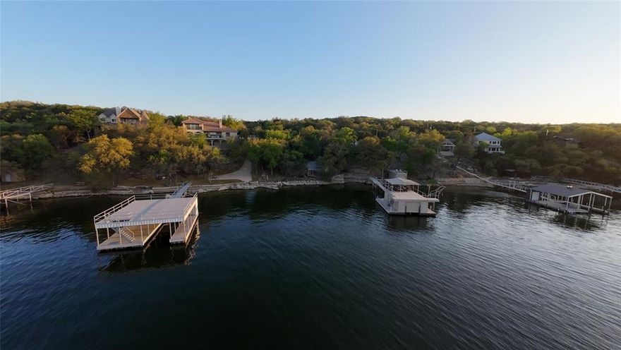 Positioned on the highly sought-after peninsula of Possum Kingdom Lake, this exceptional waterfront lot offers the perfect opportunity to build your dream lake home in one of the area’s most desirable locations. With convenient access directly off FM 2951, the property is easily reachable even with large boat trailers making this a very unique attribute for Trail Ridge Rd.

The lot offers a rare combination of usability and character featuring a wide, mostly level entry ideal for parking, storage, or a future shop, then gently transitioning to elevated terrain with natural rock features that can be beautifully incorporated into your build and landscaping. Deep water frontage provides excellent boating access, while the elevated setting captures stunning, unobstructed views of Possum Kingdom Lake.

An existing cabin is located on the property and will need to be removed, giving you a clean slate to design and build exactly what you want.

Whether you’re envisioning a weekend escape or a full time lakefront retreat, this property delivers the location, accessibility, and waterfront quality that are increasingly hard to find on Possum Kingdom.