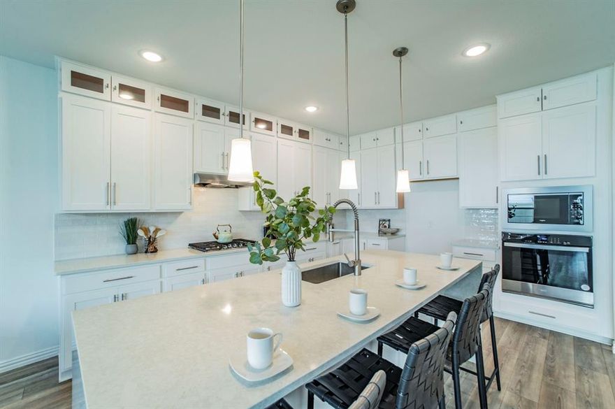 Welcome to your own small paradise in the award-winning Pecan Square community — where modern luxury meets family comfort. This stunning 5-bedroom, 3-bath home sits gracefully on a premium corner lot, offering elegance, space, and the perfect balance of indoor and outdoor living.

Step inside to discover an inviting open-concept layout filled with natural light, stylish finishes, and a seamless flow between the living, dining, and kitchen spaces. Every detail is designed for both sophistication and convenience, from the contemporary kitchen with upgraded cabinetry and sleek countertops to the spacious living room ideal for family gatherings.

Upstairs, unwind in the spacious game room or enjoy movie nights in your private media room — creating entertainment spaces the whole family will love. The owner’s suite is a serene retreat, offering a spa-like bathroom and generous walk-in closet, perfect for relaxation after a long day.

Outside, the corner lot offers added privacy and curb appeal, creating the feeling of your own peaceful haven. With the community pool, clubhouse, and amenity center just around the corner, and the on-site elementary school within walking distance, this home truly offers the best of comfort and convenience.