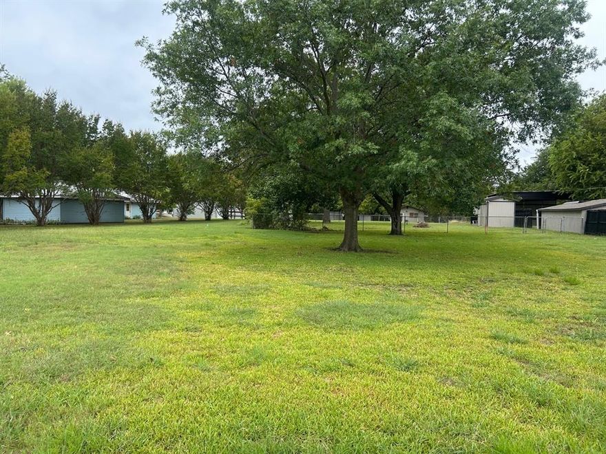 Beautiful lot to build a wonderful home in a nice lakeside community on LAKE TAWAKONI.  Nice large trees.  NEW SURVEY.  Buy now and build later.  
The boat ramp is just around the corner at the city park.  Unique opportunity to possibly purchase 2 lots back to back and have driveway off Oak Leaf Trail or Wright Way.  Purchase the home at 552 Oak Leaf Trail and purchase the 2 lots to have a HUGE yard or build 2 more homes.  New surveys on both lots and home.
Buyer, Buyers agent to verify water meter information from City of East Tawakoni and electric from Farmers Electric. 
Home on 0.462 acres MLS 20953418  Another 0.264 acres backing up to this lot on Wright Way MLS 21046356