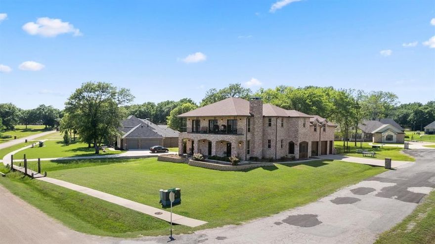 INCREDIBLE WATERVIEWS FROM THIS BEAUTIFUL HOME IN ELEGANT LIGHTHOUSE LANDING AT CEDAR CREEK LAKE. THIS 4 BEDROOM 3.5 BATH BRICK HOME IS APPROX 3915 SQFT WITH A 2.5 CAR SIDE ENTRY GARAGE. HAS TRUE HARDWOOD FLOORS, OFFICE, UPPER AND DOWNSTAIRS LIVING AREAS, PARLOR OR FORMAL DINING, PRETTY KITCHEN, PRETTY STAIRCASE AND ELEVATOR, GAS LOG FIREPLACE, 2 ENCLOSED SCREENED IN PORCHES, LARGE UPSTAIRS BALCONY WITH STUNNING VIEWS. ALSO HAS GENERAC, SYSTEM SPRINKLER SYSTEM, WROUGHT IRON FENCING AND MORE. GREAT PROPERTY IN A GREAT AREA WITH A FAST COMMUTE TO DALLAS.