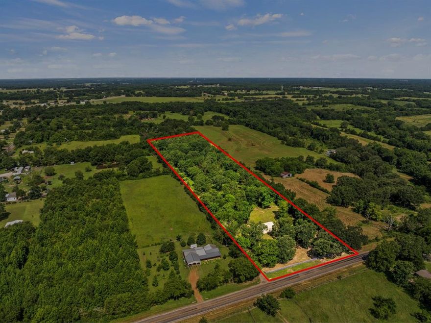 Situated in Chapel Hill ISD, this 8.51-acre property includes a 1,500-square-foot metal building with concrete floors, presenting various potential uses. The site may be suitable for residential construction or could possibly be divided into multiple lots for development. There is a water meter on Lot 1, and electricity is available to be connected to the metal building. An engineering study is required to determine water availability for any additional lots. The property offers a rural setting with towering trees to crave out your prefect setting. Come take a look!