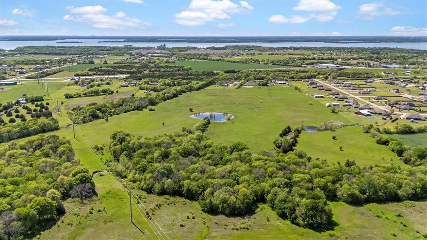 RARE OPPORTUNITY! APPROXIMATELY 2 MILES FROM LAKE LAVON! ALL INVESTORS, RANCH ENTHUSIASTS, AND DEVELOPERS MUST SEE! Multiple living quarters with pool, workshop, garage, and barn. 7191 square feet under roof not including the barn! Current agricultural exemption on all parcels. Parcels located in the county with no restrictions. Home is cozy with good bones, and with renovation; an original farmhouse could be modernized and evolve into an extraordinary retreat! Commercial grade shop with living quarters above and below currently used as a nice man cave. Rent the other 1100 square foot home for additional income or provide living quarter for a ranch hand! Approximate 100-150 foot tall cellular tower on property and is granted a permanent easement. Current owners state that tower crew maintenance is minimal. A far north entrance and alleyway could possibly be developed for privacy and easy access, as the tower sits near the north property line. Over 57 acres here so the possibilities are endless! All information to be verified by buyer and or buyer's agent.  All appointments must be scheduled 24 hour in advance. Please do not visit property unannounced and block driveways as there are some shop work and agricultural operations going on daily. Thank you for viewing this property.