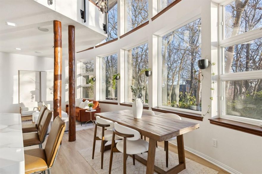 Architecturally distinctive Lake Lewisville waterfront residence situated on a 1.44-acre elevated peninsula in the Emerald Sound community, offering exceptional privacy, panoramic lake views, and direct access to the water. Designed by GGOArchitect Gary Olp, the home reflects a thoughtful integration of passive solar design, sustainable materials, and site-responsive architecture that preserves mature Texas native trees.

Expansive south- and east-facing windows with architectural overhangs provide abundant natural light while supporting year-round energy efficiency. Strategically placed north and west openings contribute to balanced interior climate control. Five Andersen double-pane glass door systems connect interior living spaces to gardens, patios, and lake views.

The cantilevered primary suite extends toward the shoreline, creating a private retreat with sunset views over the lake. Outdoor living areas include a Rumford fireplace, a sunken stone patio kitchen, and a landscaped spa setting surrounded by drought-tolerant plantings and herb gardens. A constructed pathway leads to the water’s edge with kayak storage and convenient lake access.

The exterior features cementitious stucco, ICF construction, and a standing-seam metal roof, offering durability, sound insulation, and thermal performance. The lower level provides additional storage and a temperature-controlled wine cellar. All bathrooms throughout the home have been updated, and the kitchen is enhanced by brand-new appliances, including dual ovens. A second-floor Eagle’s Nest loft features a widow’s watch window.

The property includes a four-car garage with a private guest suite offering an ensuite bath, walk-in closet, and light kitchenette designed for beverage and snack preparation. A rare opportunity to own a design-driven, energy-efficient waterfront home in one of Lake Lewisville’s most private and elevated settings.