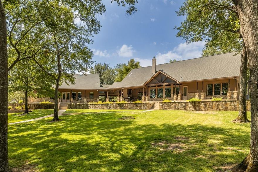 Come out to tour this STUNNING waterfront estate! You will agree this massive 5.85-acre lot with 514 feet of lake frontage will give you a larger-than-life water view from anywhere on the property.  The lake and neighborhood are beautiful and quiet. You will witness Privacy Plus, Total Build quality and careful professional house cleaning weekly.  Tall mature trees with manicured grass cover the grounds.  Accommodation includes a Main house, Guest house and Oversized Boat house.  The Main house is an open concept with high vaulted wood ceilings and tile floors.  All ceiling heights are 10 feet+ in height with solid core doors, All hard surfaced flooring and light stained wood throughout.  Have lunch and have fun at the Oversized boat house with boat, jet ski and swimmer power lifts. If needed, Private boat ramp on site and HOA boat ramp nearby.  Seriously the features are numerous, so look at additional documents in this listing and make sure to view the Video.