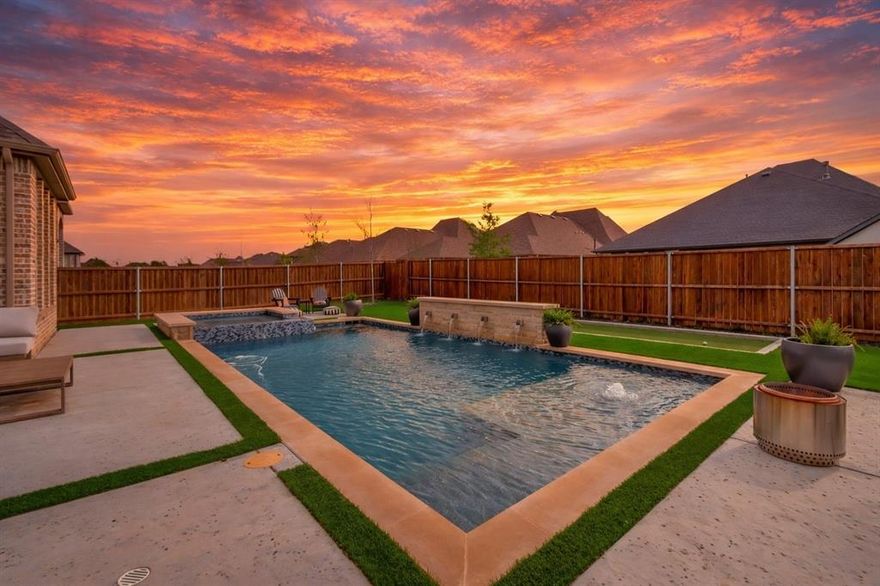 Located in the award-winning Canyon Falls master-planned community and zoned to highly regarded Argyle ISD, this stunning single-story home offers elevated design and exceptional indoor-outdoor living. Soaring 13-foot ceilings, expansive 10-foot windows, and light oak hardwood floors create a bright, open feel throughout the thoughtfully designed floor plan. The heart of the home features a seamless flow between the living, dining, and den, all connected to a beautifully appointed chef’s kitchen complete with a large peninsula and center island, double ovens, five-burner gas cooktop, and designer gold chandeliers. This well-designed layout includes four spacious bedrooms, each with a private en-suite bath, plus a guest powder bath, a private office and a media room. Step outside to a resort-style backyard featuring a pool and spa, turfed yard, and bocce ball court, perfect for entertaining or relaxing. Canyon Falls offers an incredible lifestyle with Argyle ISD elementary and high school located within walking distance inside the neighborhood, along with resort-style pools, a fitness center, clubhouse, parks, playgrounds, fishing ponds, and miles of scenic biking and jogging trails. This home blends luxury finishes, thoughtful design, and one of the area’s most desirable communities. Property is in the lowest tax rate in the neighborhood and NO MUD or PID!