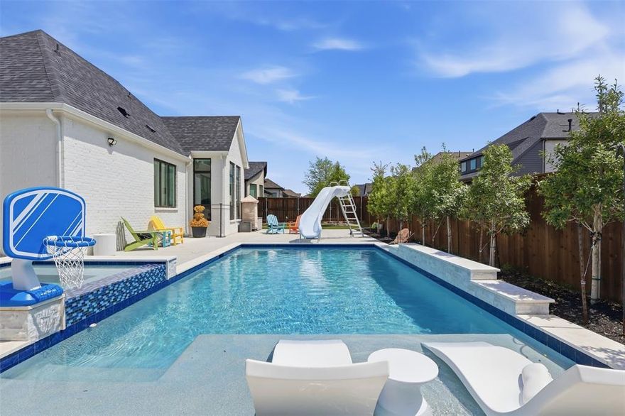 Exceptional custom Highland home in the highly sought-after Mustang Lakes community—featuring one of the only private pools in the neighborhood, a rare find! This beautifully upgraded home offers a custom pool and spa with added trees for privacy, creating a true backyard retreat.

Inside, you’ll find a grand entry with a curved staircase, white oak floors, soaring ceilings, and designer finishes throughout. Each bedroom includes its own ensuite bath. The open-concept layout connects the family room, kitchen, dining, and covered patio—perfect for entertaining. The chef’s kitchen features quartz countertops, Monogram appliances, a walk-in pantry, and an oversized island.

Additional highlights include a dedicated study with built-ins, private courtyard with sliding doors, first-floor media room, upstairs game room with wet bar, two patios, turf, putting green, 4-car garage, and mudroom.