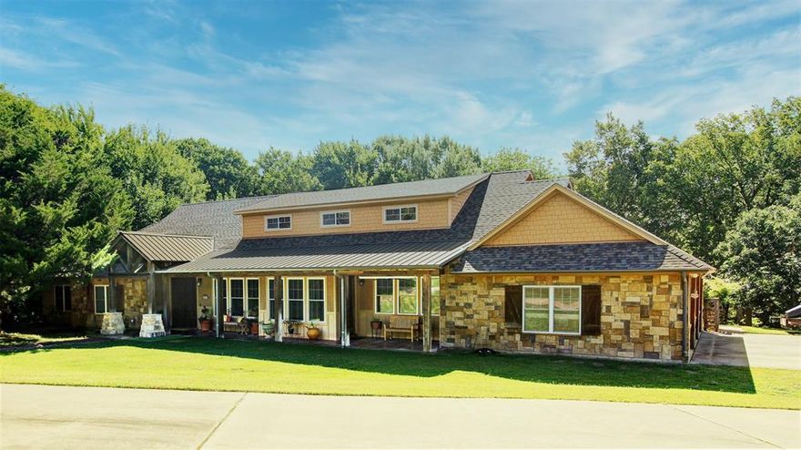 From the moment you enter the breathtaking two-story foyer, it's clear that no detail was overlooked in this custom-built home. The sellers were passionately involved in the design and in every stage of the construction, ensuring exceptional quality throughout. This four bedroom home features all en-suite bedrooms, each with spacious walk-in closets. Spacious eat-in kitchen has double ovens, 5 burner gas cooktop, dishwasher, microwave and beautiful custom knotty alder cabinets. The dedicated spacious office has built-in desks and cabinets. The upstairs spacious Bonus room is complete with a living-game room, oversized private bedroom and full bath. You will find custom cabinetry, designer light fixtures and custom Craftmade ceiling fans throughout. Each room is unique in showcasing attention to craftsmanship and style. Enjoy stained concrete floors, vinyl low-E windows and a 2018 Roof for efficiency and durability. The whole house water filtration system adds to the comfort and peace of mind. Relax on the covered front and back porches taking in breathtaking views of your private creek lot. This home and lot blends elegance, quality and the serenity of nature and is truly one of a kind. A Must-See.