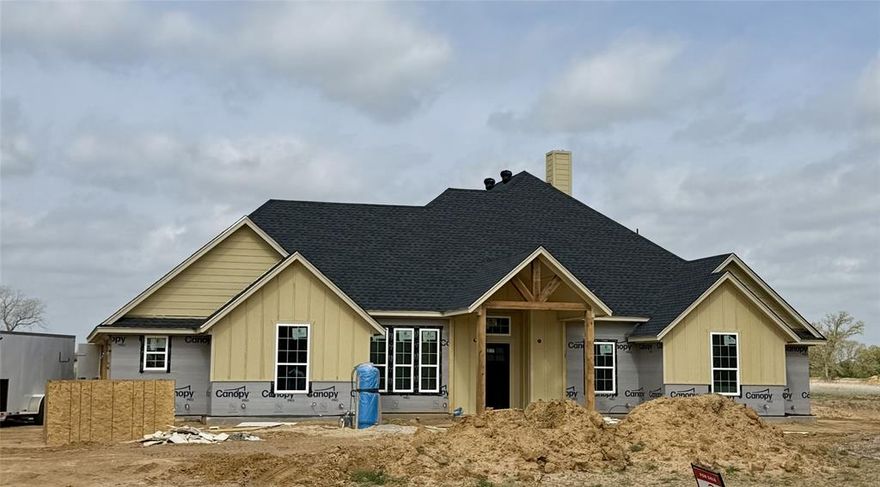 Welcome to your new country retreat in beautiful Parker County!  Sitting on 2 acres, this 4 bd, 2 ba, open floor plan home with study allows for an easy-living lifestyle. An abundance of windows allows lots of natural light to fill the generously sized living & kitchen areas. A vaulted ceiling in the lvg room, and wonderful wood-like tile floors flow throughout the main areas of the home. Fantastic features of the kitchen include: custom-built cabinets, granite counters, island with seating, divine walk-in pantry, separate cook-top, stainless steel built-in oven and microwave. Greet the morning with coffee, or unwind in the evening, on the covered patio with fireplace overlooking the spacious backyard. At the end of the day, escape to the private  owner’s ensuite and indulge in a luxurious soak in the tub. The secondary bdrms are nicely laid out and separated from the owner’s suite and, all bedrooms and closets will have carpet. Whether you are working from home or entertaining, you will be ecstatic about calling this place your home.