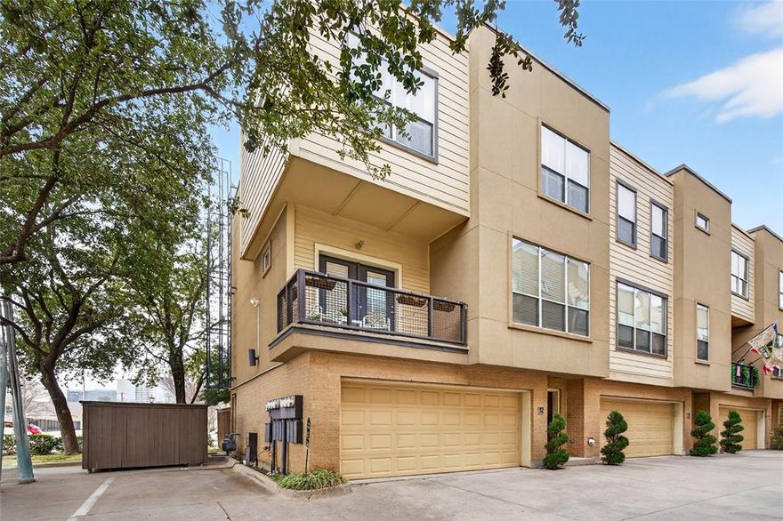 This light-filled corner-unit condo in Kensington Court offers three thoughtfully designed levels and an unbeatable location directly across from Cole Park. The main living level features an open-concept living, dining, and kitchen space with wood flooring throughout, abundant natural light, and a bright, updated kitchen ideal for both everyday living and entertaining. A private balcony also extends the living space outdoors. Upstairs, the home offers two bedrooms, including a spacious primary suite with a walk-in closet and an ensuite bath featuring a soaking tub. A separate guest bedroom and full guest bath provide flexibility for visitors or a home office. The first level includes a two-car attached garage complete with a Tesla charger, access to a downstairs entry hall, and a private turfed yard—perfect for low-maintenance outdoor enjoyment.  HOA includes structural and grounds maintenance, water, gas, trash removal and more! Convenient guest parking just outside the front door. Just steps away, 7-acre Cole Park offers tennis and pickleball courts, trails, a playground, and more. Located just minutes from West Village, the Katy Trail, SMU, and I-75, this move-in ready condo blends modern comfort with a highly walkable, connected urban lifestyle in  the heart of Dallas.