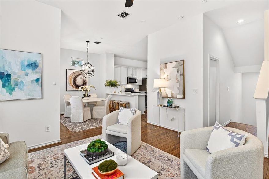 This light-filled corner-unit condo in Kensington Court offers three thoughtfully designed levels and an unbeatable location directly across from Cole Park. The main living level features an open-concept living, dining, and kitchen space with wood flooring throughout, abundant natural light, and a bright, updated kitchen ideal for both everyday living and entertaining. A private balcony also extends the living space outdoors. Upstairs, the home offers two bedrooms, including a spacious primary suite with a walk-in closet and an ensuite bath featuring a soaking tub. A separate guest bedroom and full guest bath provide flexibility for visitors or a home office. The first level includes a two-car attached garage complete with a Tesla charger, access to a downstairs entry hall, and a private turfed yard—perfect for low-maintenance outdoor enjoyment.  HOA includes structural and grounds maintenance, water, gas, trash removal and more! Convenient guest parking just outside the front door. Just steps away, 7-acre Cole Park offers tennis and pickleball courts, trails, a playground, and more. Located just minutes from West Village, the Katy Trail, SMU, and I-75, this move-in ready condo blends modern comfort with a highly walkable, connected urban lifestyle in  the heart of Dallas.