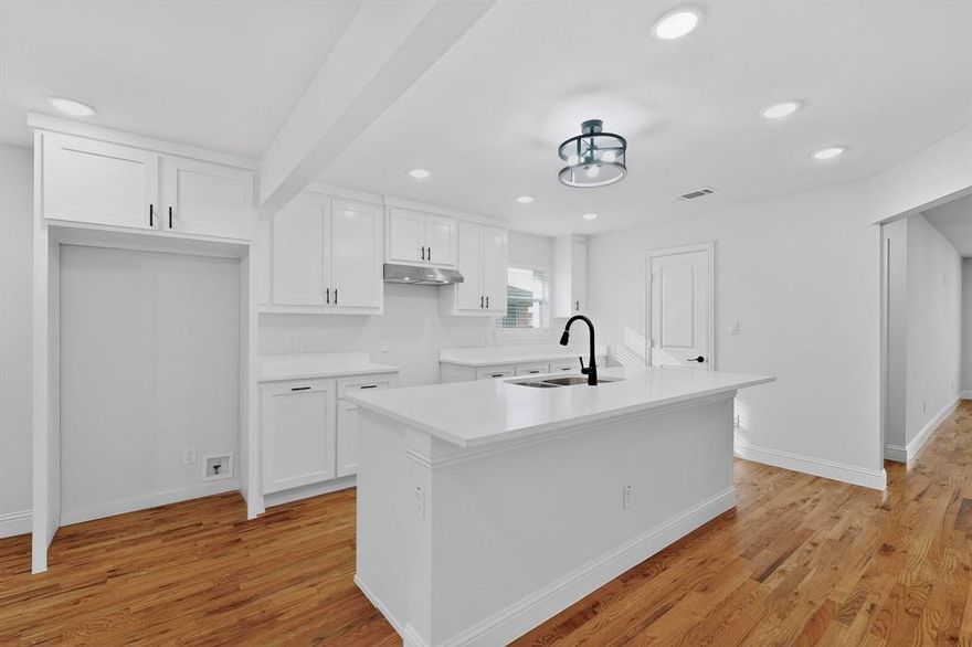 Extensively rebuilt 4 bedroom, 2.5 bath home in a quiet, established Dallas neighborhood with no HOA. Nearly everything is brand new, including plumbing, electrical, HVAC, interior doors, blinds, decorative lighting, and concrete. Original wood floors have been professionally refinished.
Open concept kitchen features custom cabinetry, granite countertops, large island, pantry, gas availability for a gas stove, and granite throughout kitchen and all bathrooms with built in cabinets. Living room showcases a large, beautiful bay window. All bedrooms offer large closets and ceiling fans. Spacious primary suite includes dual sinks, separate tub, and walk-in shower. Dedicated hallway laundry area with space for full size washer, dryer and guest half-bath located in the hall for added convenience. Additional highlights include gated driveway with iron steel vehicle gate, large backyard, two-car detached garage with brand new garage door, new concrete driveway from garage to front sidewalk, fenced HVAC area, central heat & air, and security cameras to convey. Roof is not new but has been professionally inspected and is in excellent condition. Elementary school within walking distance and easy access to major freeways, shopping, and dining.