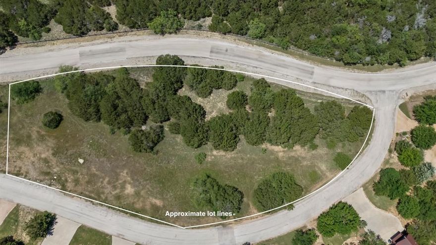 Beautiful, treed lot within the amenity rich Harbor community. Build inside Possum Kingdom's most prestigious development or a great lot to purchase as a membership for access to all the resort style amenities the Harbor offers. Walking distance to large fishing pond, main resort pool and the fitness center! The Harbor boasts an array of upscale amenities that can be used year round. House plans available for purchase!