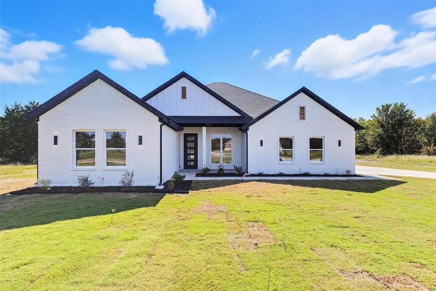 OFFERING up to $5,000 in CONCESSIONS!! Buyer can use it towards closing cost, or to buy down the interest rate!  Beautiful 3-2-2 home nestled in Grison Estates Community. 3 Bed, 2 FULL bath, 2 Car garage, and Office (total of 4 ROOMS) . Home features ceramic tile floors, decorative lighting, custom built-in cabinets throughout. Calcutta Venezia QUARTZ Counter tops throughout, vaulted ceiling in living area and wood log Fireplace. Kitchen boasts a large custom built island with 36 inch sink, electric range, perfect for both entertaining and daily living. Master bath features tub, shower, HIS and HERS vanities, and walk-in closet with built-in dresser and shelves (CUSTOM CABINETRY throughout).  Back Covered patio with ceiling great for those outdoor family gatherings.  Finishing touches are still being made to the home, ex touchup paint etc.