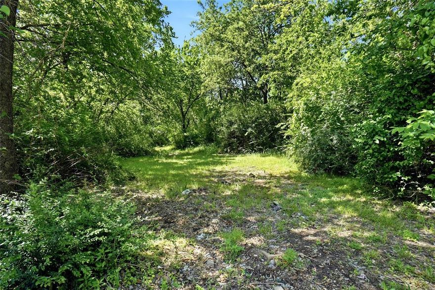 Rare Build-Ready Lot on Paisley Street. Tucked between two well-loved homes on Paisley Street in Denton, this exceptional .276-acre vacant lot offers something increasingly hard to find: the groundwork is already done. Water and sewer taps are in place and ready to serve your new build, eliminating the costly delays and upfront expense that typically come with raw land. Just bring your plans and your builder.
The setting is as inviting as the opportunity itself. Mature trees frame the property on all sides, casting natural shade and lending the instant character that only decades of growth can provide. This isn't a bare, cleared lot in a sea of new construction, it's a canvas nestled within an already thriving Denton neighborhood. Zoned R4 single-family residential, the lot is purpose-built for your dream home. For the visionary buyer or investor, the city allows duplex or townhome construction with a special use permit — a compelling path to maximize the value of this well-positioned Paisley Street parcel.
At .276 acres, there's room to build with intention — space for a thoughtful floor plan, a backyard worth living in, and breathing room between you and the neighbors. Opportunities like this are quietly rare in Denton: a shovel-ready lot with utilities connected, a lush natural setting, and the flexibility to build for today or invest for tomorrow. Come walk Paisley Street — you'll feel the potential the moment you arrive.