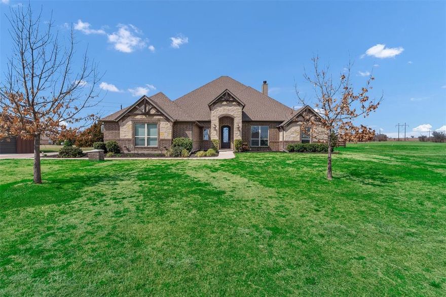 2 ACRES OF PRIVACY.INGROUND GUNITE POOL AND SPA.SHOP WITH ELECTRIC AND INSULATED.ONE STORY OPEN FLOORPLAN.NO WATER BILL...Custom built one story home on 2 acres nestled on a cul de sac featuring 4 bedrooms, 3 baths, a gameroom, 3 car garage, plus a 20x30 insulated shop with electric, heated inground gunite pool and spa, outdoor covered patio with wood burning fireplace. The oversized kitchen offers granite countertops, large island, farmhouse sink, pot filler, double ovens, gas stove, walk in pantry, and travertine backsplash. Handscraped hardwood floors highlight the main living areas with wood beams, crown molding, and a floor to ceiling stone fireplace in the living room. The private primary suite features coffered ceilings, and a spa like atmosphere featuring a custom oversized shower with a separate bath, along with an oversized primary closet. Additional upgrades include 2 inch wood blinds, framed windows, 20 inch tile in wet areas, and a striking 9 foot iron front door. Fresh landscaping completes this move in ready acreage retreat.