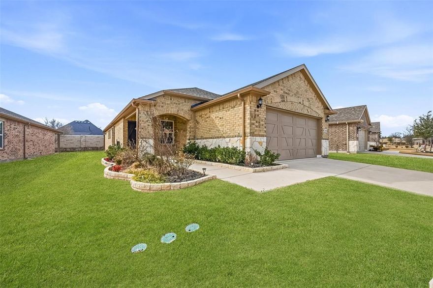 Step into effortless elegance in this barely lived-in 2022 home in Del Webb at Trinity Falls, McKinney’s premier 55+ active adult community. This upgraded single-story showpiece features luxury vinyl plank flooring and has an airy open-concept design anchored by a designer kitchen with soft-close cabinetry, granite island and eat-in space built for gathering. A bright sunroom overlooking the backyard adds valuable extra living space perfect for relaxing or entertaining. The spacious primary suite feels spa-inspired with an oversized walk-in shower and dual-sink vanity, while the flexible third bedroom or den adapts beautifully as an office or creative retreat. Enjoy coffee on the covered front porch or unwind beneath the backyard pergola in your landscaped, semi-private yard with stone fence. The garage shines with epoxy flooring and built-in shelving that will stay. Residents enjoy resort-style pools, fitness center, pickleball, lakes, trails and a vibrant social calendar, with full access to both Del Webb and Trinity Falls amenities. Minutes to new H-E-B, shopping, dining and major highways, this is low-maintenance luxury living in the heart of McKinney.