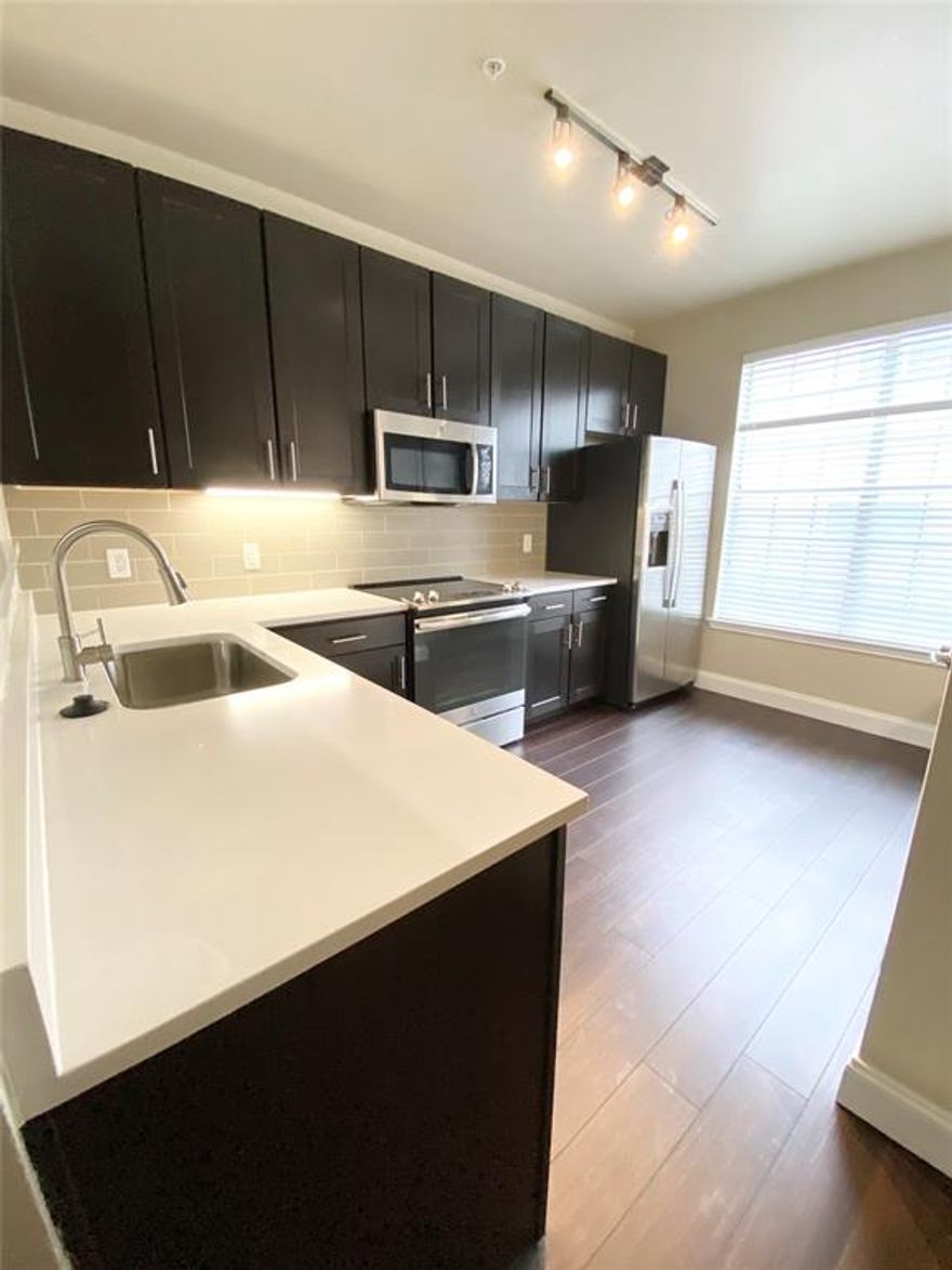 A MUST SEE TOWNHOME conveniently located near Preston Hollow and Park Cities! Walking distance to restaurants & shops! This property features on-site maint & mgmt, 24hr fitness center, resort style swimming pool,clubhouse,outdoor lounge with grilling areas, business center & much more. Spacious 1 bed 1 bath floorplan. This unit features beautiful amenities including: farm sink, quartz countertops, high ceilings,stainless steel appliance package, built in desk & 1 car attached garage.A large green space in front of unit is perfect for your pet! Pricing and availability subject to change at any time. Please call to verify pricing.