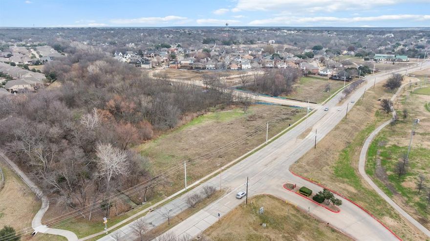 Rare 6.06-acre development parcel with a prestigious McKinney address in a prime growth corridor. Positioned directly across from an amenity-rich park with a huge pond, kids baseball stadium, and walking trails, the site offers a beautiful, tranquil setting built for an active lifestyle. Located just off US-75 near a major commercial hub, it’s also next to McKinney High School, with strong surrounding momentum as $1.2M+ homes are being built directly behind the property. The heavy lifting is done: the City has approved plans for 26 prestigious high-end townhomes, and the property conveys with the city-approved permit, drawings, and site plan—creating a massive opportunity for a developer to deliver a premium product in one of McKinney’s most desirable and convenient locations.