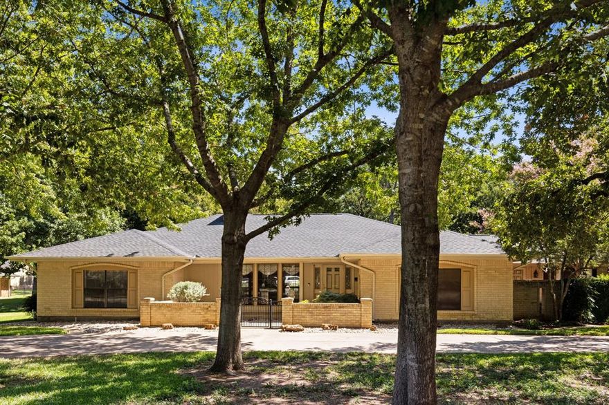 Absolutely charming ranch-style home situated on a large lot in the heart of the city. Mature trees and lush landscaping really make this nearly 1-acre home site come to life. For those who need extra storage space, that collect cars, or just like to tinker....there is a spacious 3 car garage and roughly 800 square foot metal building with over sized RV doors. With an open concept split floor plan, all this home needs is a little TLC to bring it current. Conveniently located near major highways, schools, and plenty of retail.