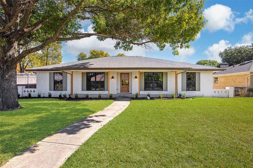 Nestled within the verdant canopy of Lochwood, this reimagined home (2025) marries organic sophistication with nuanced craftsmanship. Beyond the storybook curb appeal, a foyer of textured tones introduces a great room anchored by an elegant fireplace, seamlessly adjoining a dining nook and an exceptional chef’s kitchen.

The kitchen centers around a deep-toned peninsula with seating for five—ideal for casual entertaining—while a six-burner gas stove and custom vent hood elevate the culinary experience. Refined cabinetry flows seamlessly into a butler’s pantry, complete with wine refrigerator and expansive storage and decorating possibilities. At the opposite side, the charming dining nook offers a third opportunity for gathering, while the private corridor behind it reveals an efficient laundry room, and a rear-facing 2-car garage that preserves graceful curb appeal. 

When it's time to unwind, the floor plan delivers. One wing houses a distinct fourth bedroom with private outdoor access—ideal as a guest room, office, or play room. Opposing this, a hall with decorative niche connects two secondary bedrooms with access to a stylish full bath. The primary suite offers a spa-level ensuite, featuring a soaking tub, frameless glass shower with two shower heads, and stunning modern fixtures.

Beyond the interiors, a covered patio—perfect for morning coffee or an evening aperitif—opens to a lush, shaded backyard, offering a calm and timeless setting. Stroll along tree-lined streets toward the neighborhood playground and the creek, and experience the setting unique to Lochwood. Just a 10-15 minute drive from downtown Dallas and close to vibrant amenities, this beautiful home awaits.