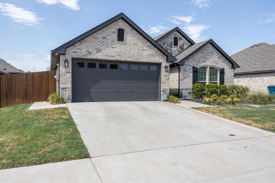 Exquisite Antares Model home with modern comfort and scenic surroundings! Nestled in a peaceful community, this barely-lived-in 3-bedroom, 2-bath gem has been meticulously maintained and thoughtfully designed. Showcasing the Antares model’s stylish layout, this home features elegant curb appeal, a manicured front yard, charming sidewalks, and a finished 2-car garage for extra storage and convenience. Step inside to a bright, open-concept living space that blends comfort and function. The chef-worthy kitchen boasts sleek granite countertops, stainless steel appliances, and a breakfast bar—perfect for entertaining or everyday meals. Refrigerator, washer, and dryer are all included for a true move-in-ready experience. 
The spacious primary suite is a serene retreat with ample natural light and an en-suite bath. Two additional bedrooms provide flexibility for guests, a home office, or creative space. A covered back patio opens to a fully fenced yard with a wood privacy fence—ideal for relaxing, dining, or play. 
Enjoy quick access to Hwy 67 and Chisholm Trail Pkwy for easy commuting. Outdoor lovers will appreciate the proximity to Cleburne State Park and Lake Pat Cleburne for hiking, fishing, or weekend picnics. Neighborhood features include curbs, sidewalks, and a community mailbox, enhancing the charm and walkability. Blending tasteful finishes, thoughtful inclusions, and a prime location near nature and conveniences, this home is a rare find. Don’t miss your chance to own a beautifully cared-for model home that offers modern elegance and a lifestyle connected to the outdoors.