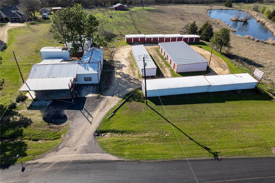 High-visibility commercial property offering an excellent opportunity for retail, service, or owner-user operations along a well-traveled roadway with over 24,000 average daily traffic.
The property is fully fenced and features approximately 1,500 SF of retail frontage with a covered patio, ideal for customer-facing businesses seeking strong exposure. 
Adjacent to the retail space is a 650 SF insulated shop, along with a 1,200 SF warehouse featuring tall ceilings and roll-up doors, providing flexible space for storage, operations, or light industrial use. 
A newly installed aerobic septic system adds long-term value and efficiency. 
A red barn located at the rear of the property is not included in the total square footage and is excluded from the offering. 
The nearby storage facility is not included in the sale.
Buyer to verify zoning, permitted uses, and all property details.