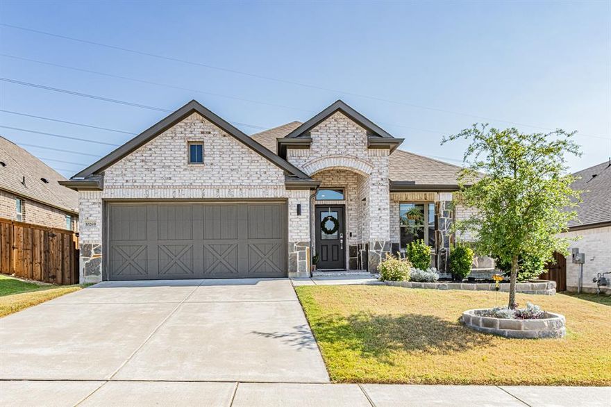 Nestled on a spacious lot in the Benbrook community, this beautifully designed home offers the lifestyle you’ve been waiting for, AND it's zoned for the new Rolling Hills Elementary! Step inside and be welcomed by fresh paint, soaring ceilings, an open-concept floor plan, and an abundance of natural light that makes every space feel warm and inviting. Keep your shoes and bags organized in the finished out mudroom right off of the garage. Make your way into the kitchen that is a true showstopper and the heart of the home—featuring quartz countertops, stainless steel appliances, an oversized island with seating, and custom cabinetry that will delight any home chef. The living room boasts panoramic windows overlooking the backyard, creating the perfect spot for family gatherings or entertaining friends. Speaking of entertainment, let your imagine run wild with the extra room. Use it as an office, a man cave, a theater room or the space where your new home business blossoms. Retreat to the primary suite, complete with dual vanities, soaking tub, and a walk-in shower. Additional bedrooms are generously sized with ample storage, offering comfort for family or guests. Outside, enjoy peaceful Texas evenings under the covered patio or host summer barbecues in the expansive backyard—plenty of room for a pool, garden, or play area.