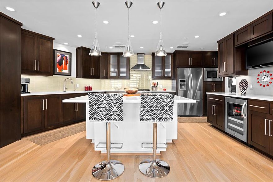 Discover a rare opportunity to own a one-of-a-kind, boutique-sized residence in the exclusive Neil P building, ideally situated across from Burnett Park and the Fort Worth Club in Downtown Fort Worth. This immaculate, fully furnished condo feels like a model home, showcasing an open, versatile floor plan that’s perfect for entertaining. Custom-designed combining two units with a contemporary aesthetic, this residence features high-end finishes, including 5-inch white oak flooring and six 6-foot north-facing windows that fill the space with beautiful, indirect natural light.
The gourmet kitchen is a chef’s dream, boasting a spacious island, dual-fuel convection range, wine cooler, and ample cabinetry, pantry and slide-out drawers, all highlighted by quartz countertops. Each of the split bedrooms offers generous space and an en suite bath, ensuring comfort and privacy. A private office with a custom desk and storage is conveniently located at the entry, providing a dedicated workspace.
Additional features include a climate-controlled 13' x 7' basement storage unit, and this unique offering comes fully furnished, from furniture and artwork to dinnerware, pots, pans, and all bedding and linens. A true Downtown Fort Worth gem that’s move-in ready—simply bring your suitcase!  Parking spots are #953 and #939