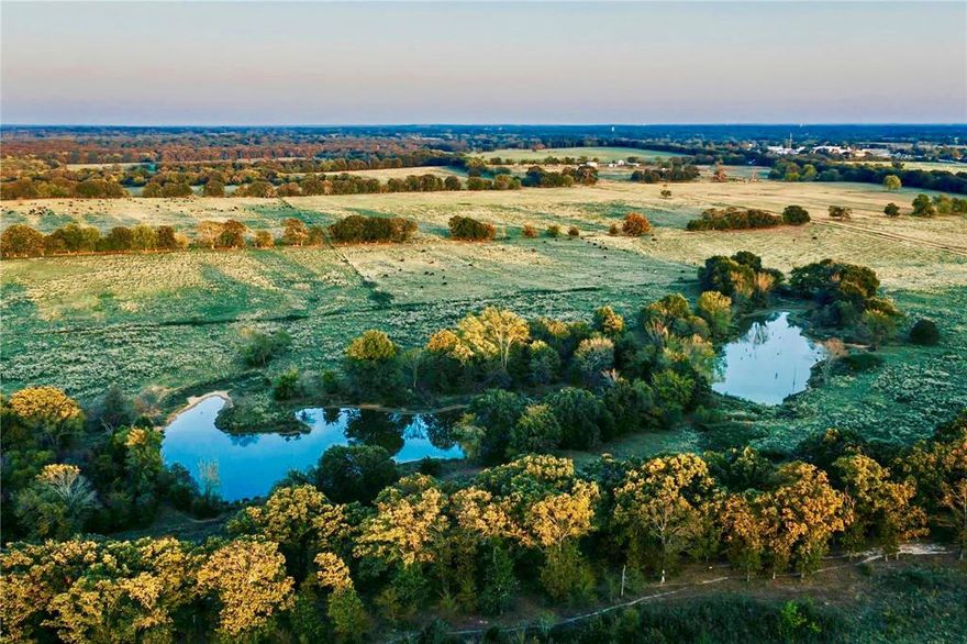 One of the few larger tracts in Hopkins County is this Ag Exempt 546.95 acres in sandy soil! Property includes lakes, ponds, and nice interior roads for easy access to livestock and pastures. There are several outbuildings currently used as barns and storage. For living quarters or to rent or live in while building is a 3bed, 2bath mobile home. The ranch is currently leased until August 2024. See agent for details. A great location with lots of options!