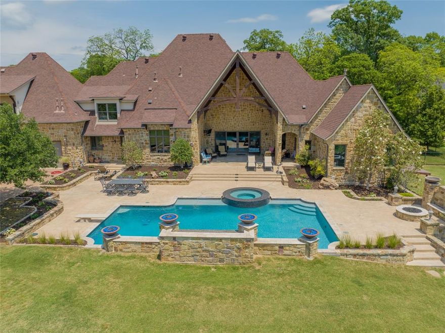 Exquisite custom built home nestled on over 10+ acres of beautiful Texas country living.Epitome of luxury and tranquility. Enchanted by the backyard oasis that awaits a sparkling POOL, soothing SPA, captivating water, fire features beckon you to relax and rejuvenate.With its sprawling grounds, large pond,breathtaking pasture views.This property promises a lifestyle beyond compare.Architectural masterpiece.Prepare to be captivated by its expansive,open concept design,large living, dining areas,Chef’s kitchen with 2 islands,complete with top-of-the-line appliances.3 FP, 5 bedrooms, 4.5 bathrooms is enhanced by the meticulous attention to detail and upgraded finishes throughout. Every inch of this home exudes elegance and sophistication,from the gleaming hardwood floors to the soaring ceilings. Complete with ample parking, detached 60x35 insulated workshop with electric,a separate detached OFFICE that provides a quiet oasis for productivity. Backyard oasis that will leave you breathless.